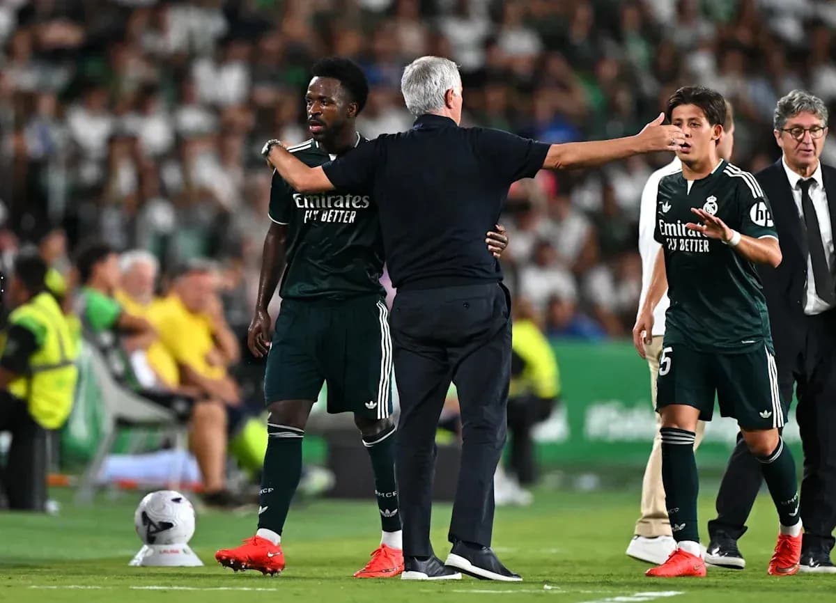 Real Madrid players receiving instructions from coach