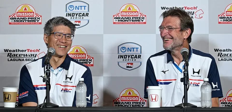 Two speakers at a press conference for IndyCar series
