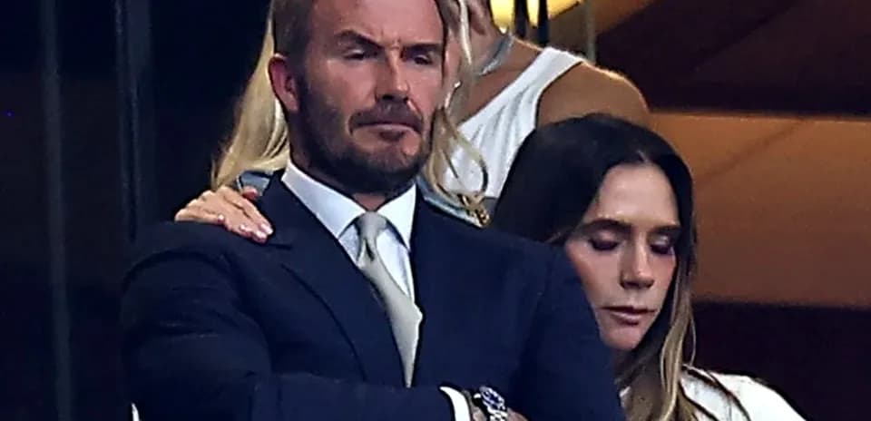 David Beckham and a woman in a private box