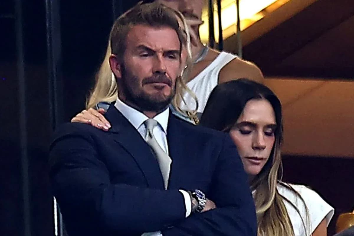 David Beckham and a woman in a private box