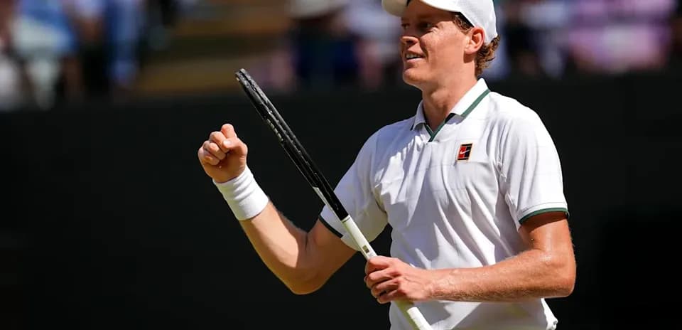 Tennis player celebrating during a match at Wimbledon