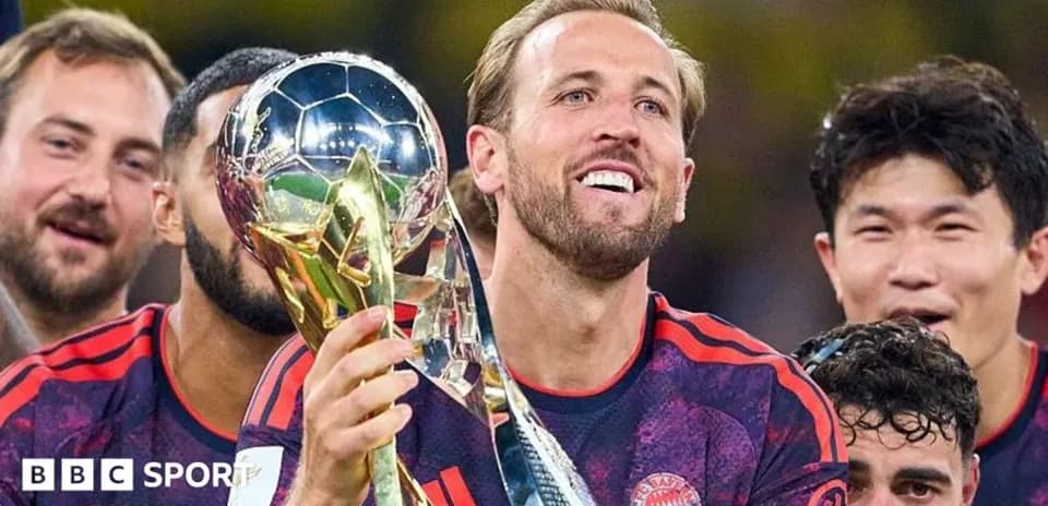 Player celebrating with trophy after winning match