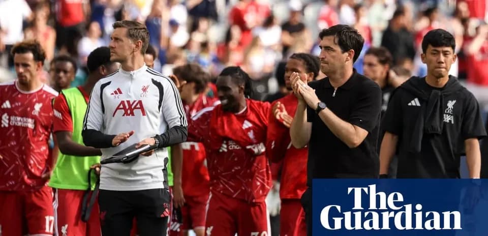 Liverpool players and staff applauding fans post-match