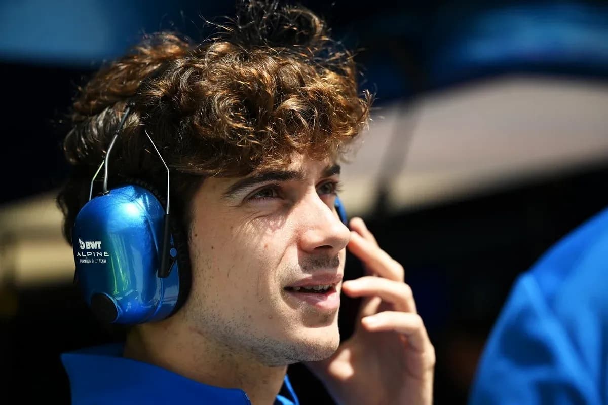 Young man wearing headphones and talking on phone