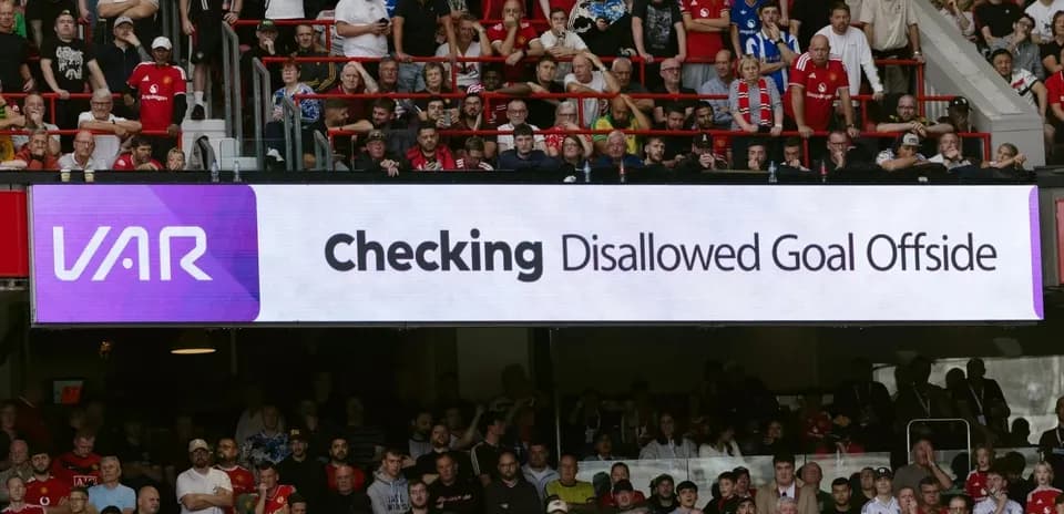 VAR screen displaying disallowed goal message in stadium
