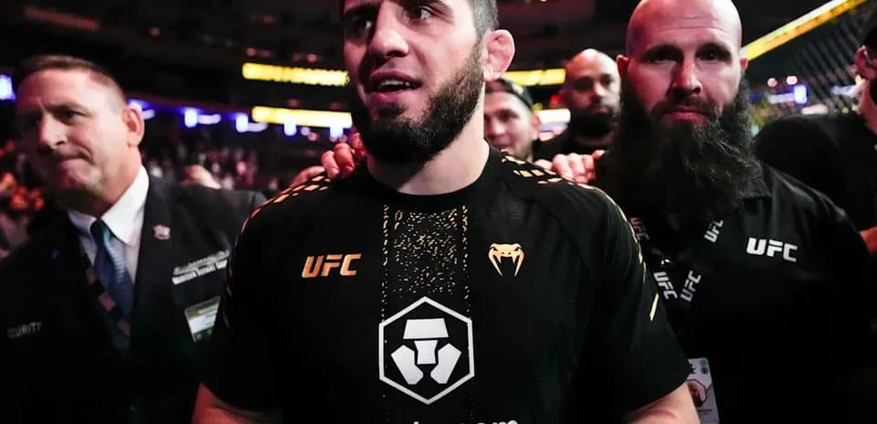 MMA fighter entering arena with team members