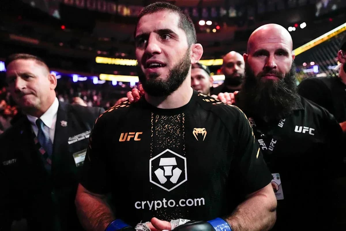 MMA fighter entering arena with team members