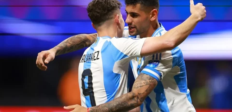 Duo of players celebrating a goal for Argentina