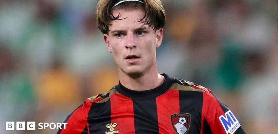 Bournemouth player during match in black and red jersey