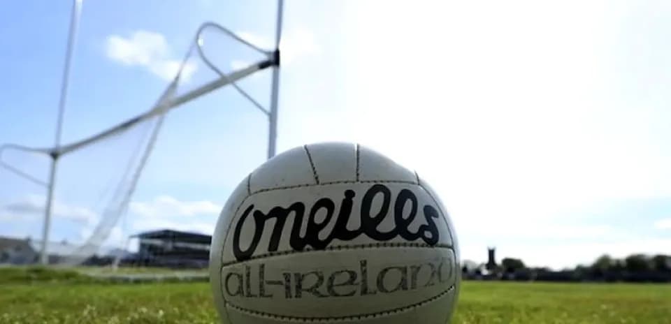 GAA football on pitch near goalpost