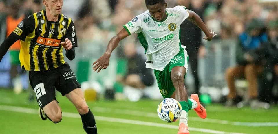 Two players competing for the ball during match