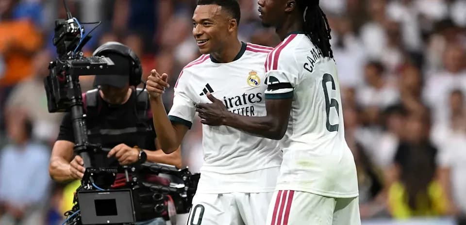 Mbappe celebrating a goal with teammate Camavinga