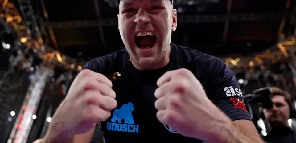Boxer celebrating victory with clenched fists
