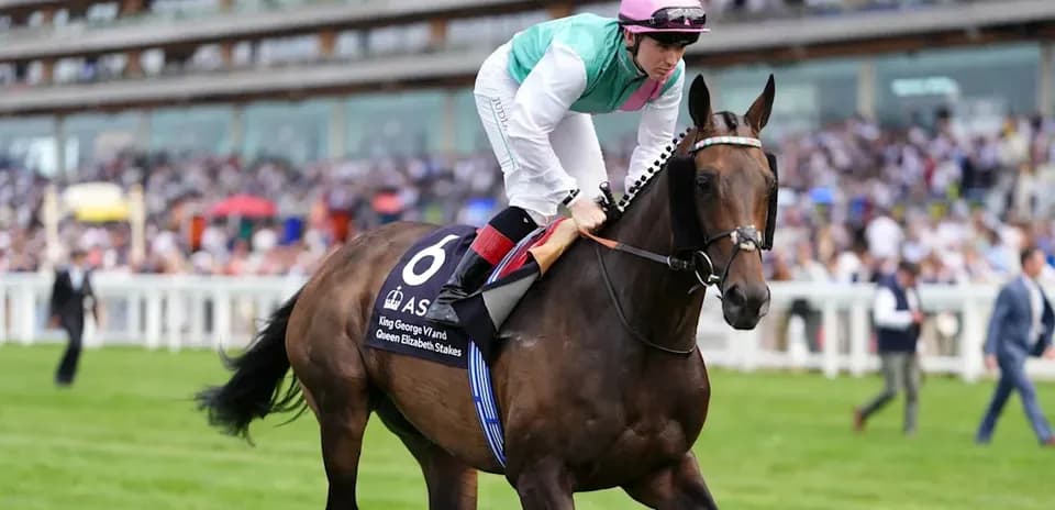 Jockey riding horse during race event at Ascot