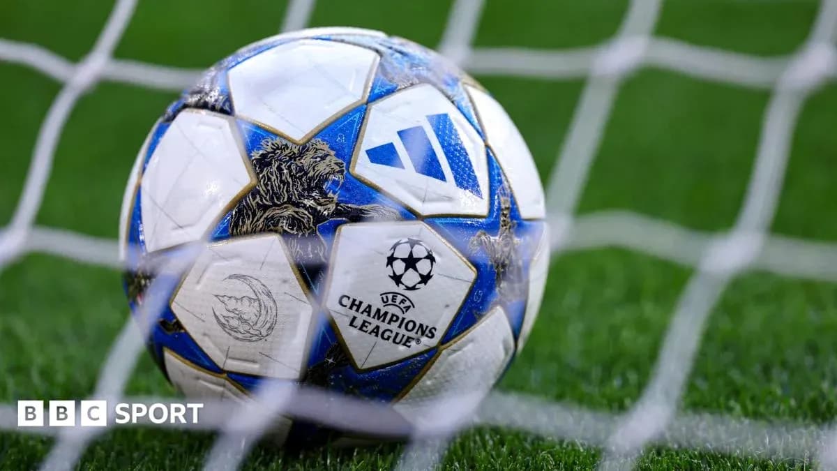 Champions League football resting in goal net