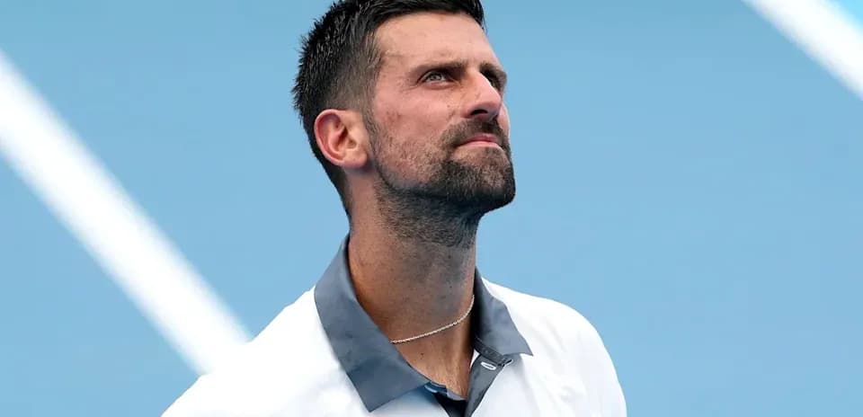 Tennis player looking up during a match