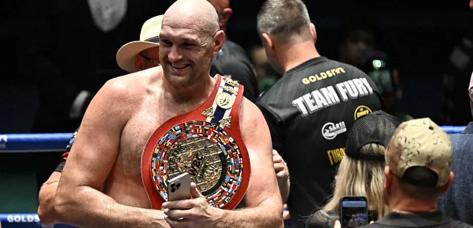 Bokschi chempioni belgisida medallar bilan tasvirlangan