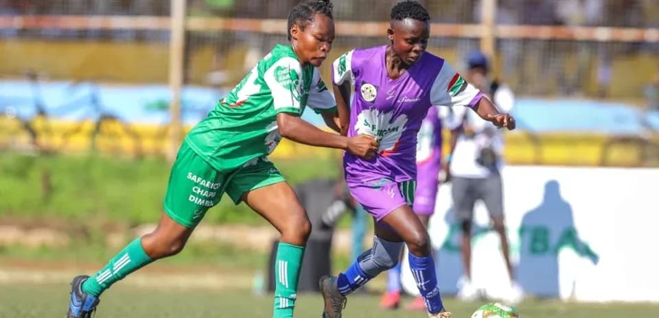 Two players competing for the ball in match