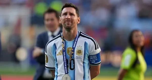 Lionel Messi wearing Argentina jersey with medal