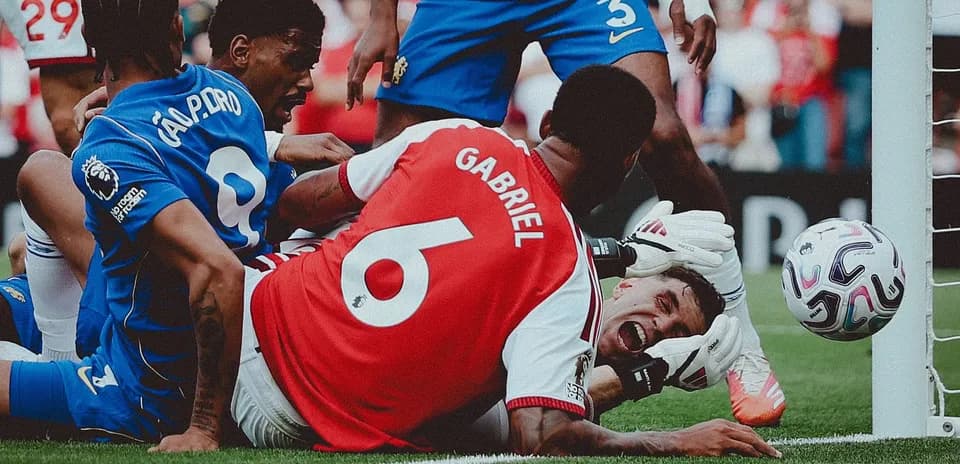 Players contesting near goal during intense match moment