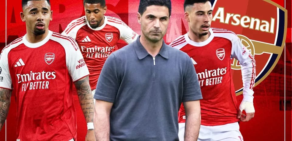 Arsenal players and manager in team jerseys