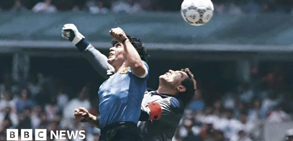 Goalkeeper attempting to catch the ball during match
