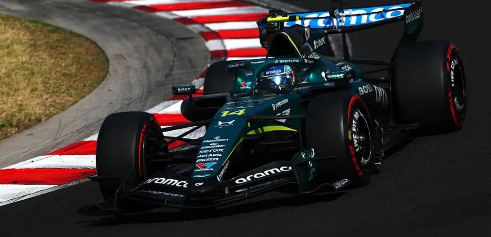 Formula 1 car navigating a sharp turn on track