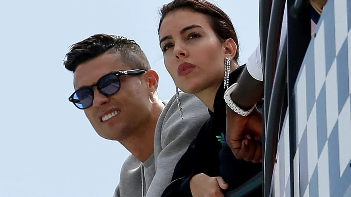 Cristiano Ronaldo and partner watching from balcony