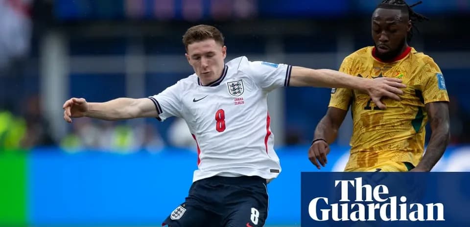 England player tackling opponent during football match