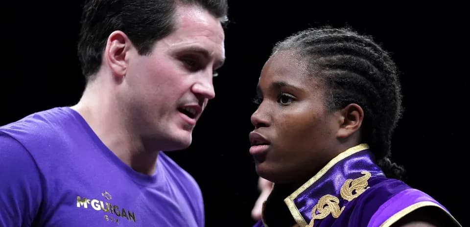 Boxer receiving advice from coach before match