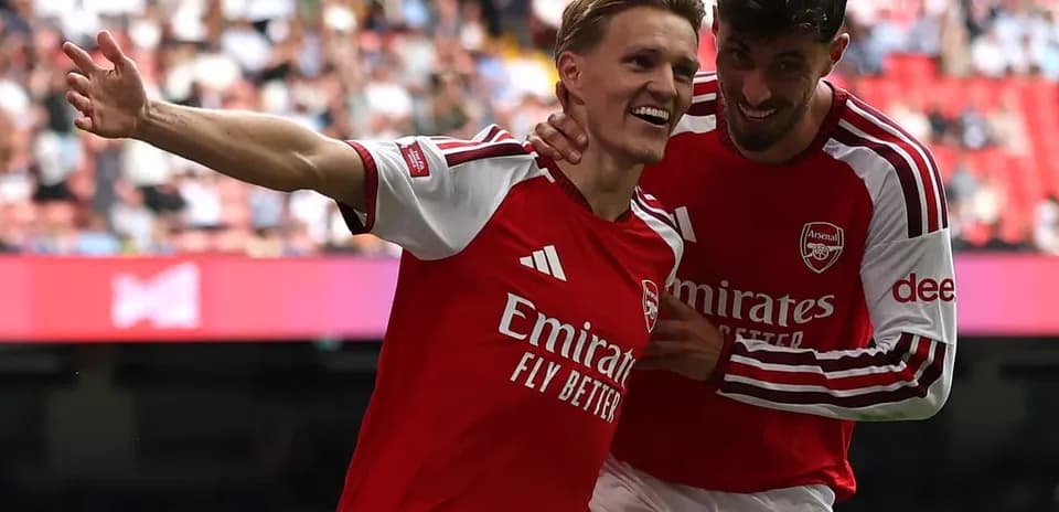 Arsenal players celebrating after scoring a goal