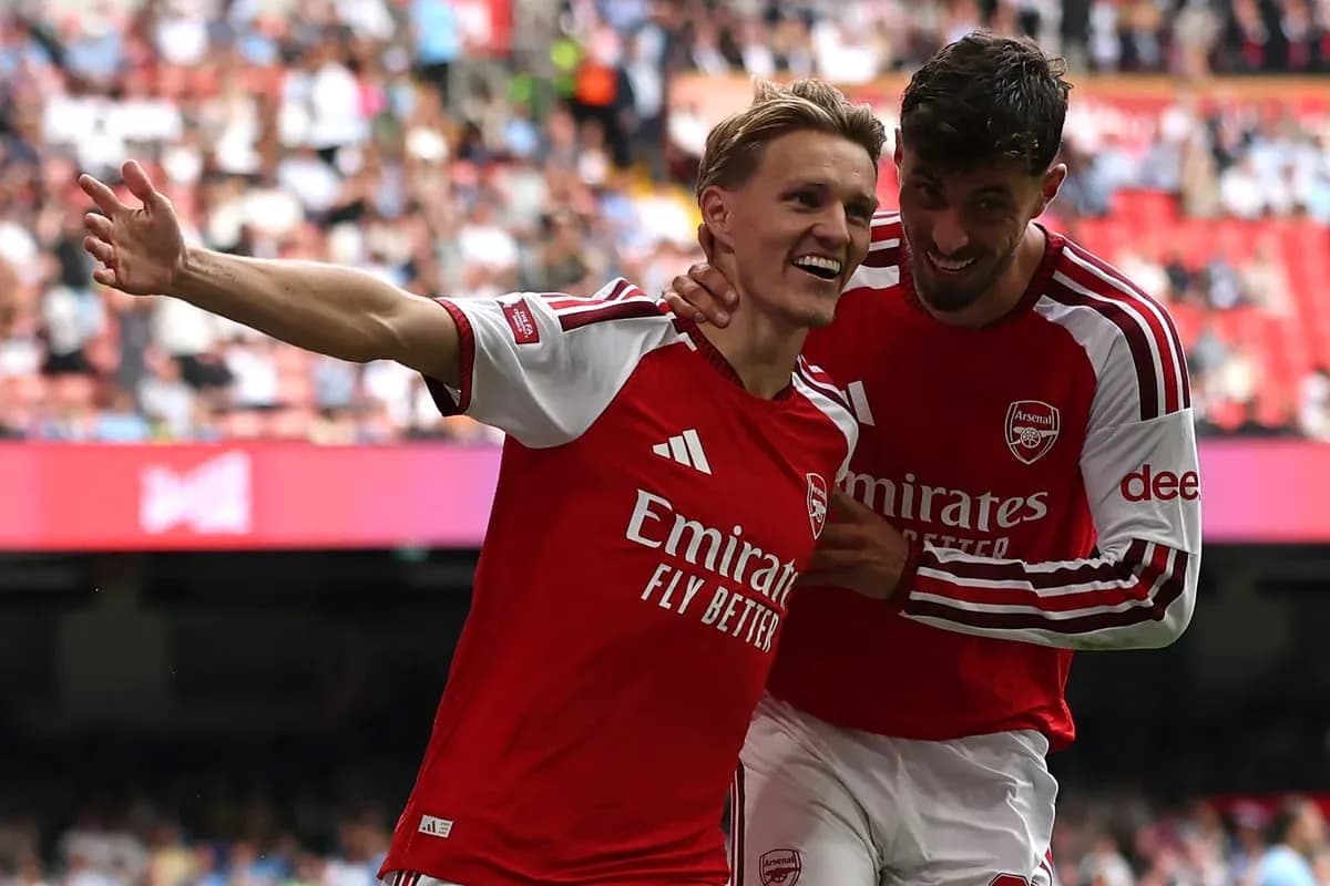Arsenal players celebrating after scoring a goal