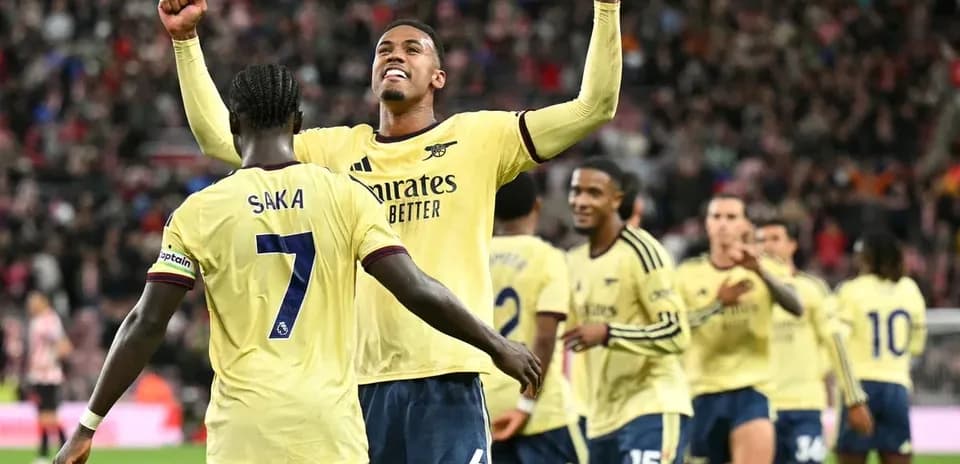 Arsenal players celebrating after scoring a goal