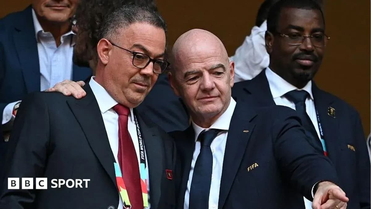 Two officials discussing at a sports event