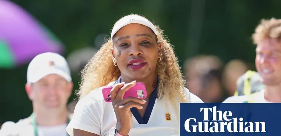 Tennis player holding a phone during event