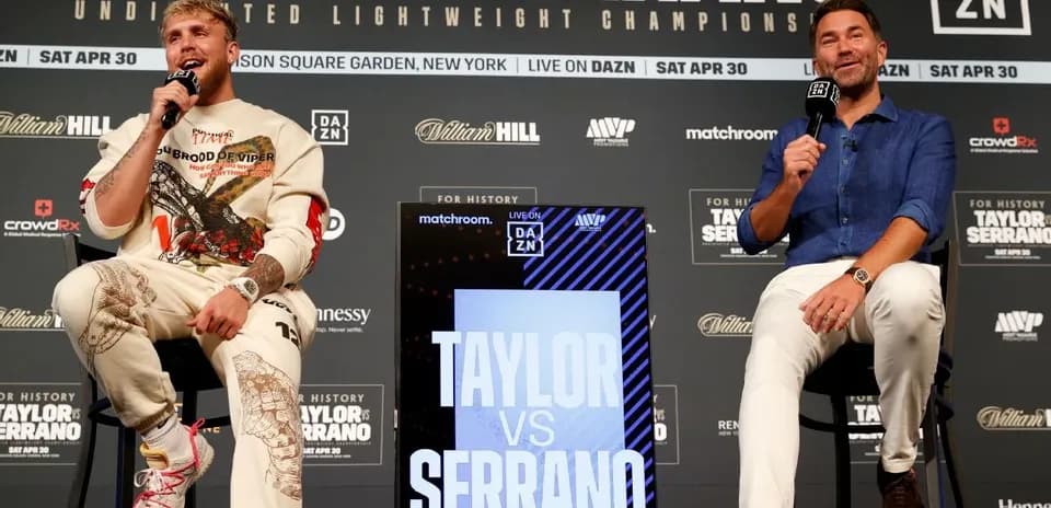 Jake Paul and promoter discussing upcoming boxing match