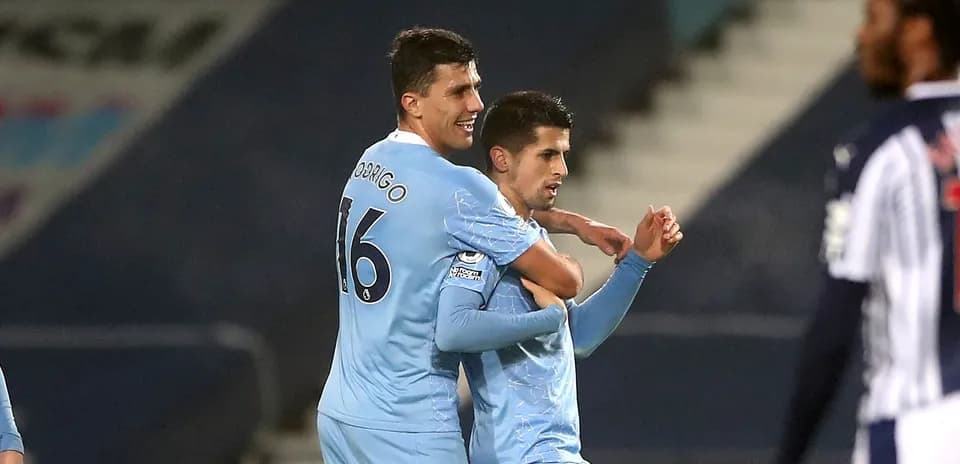Two players celebrating a goal during a match
