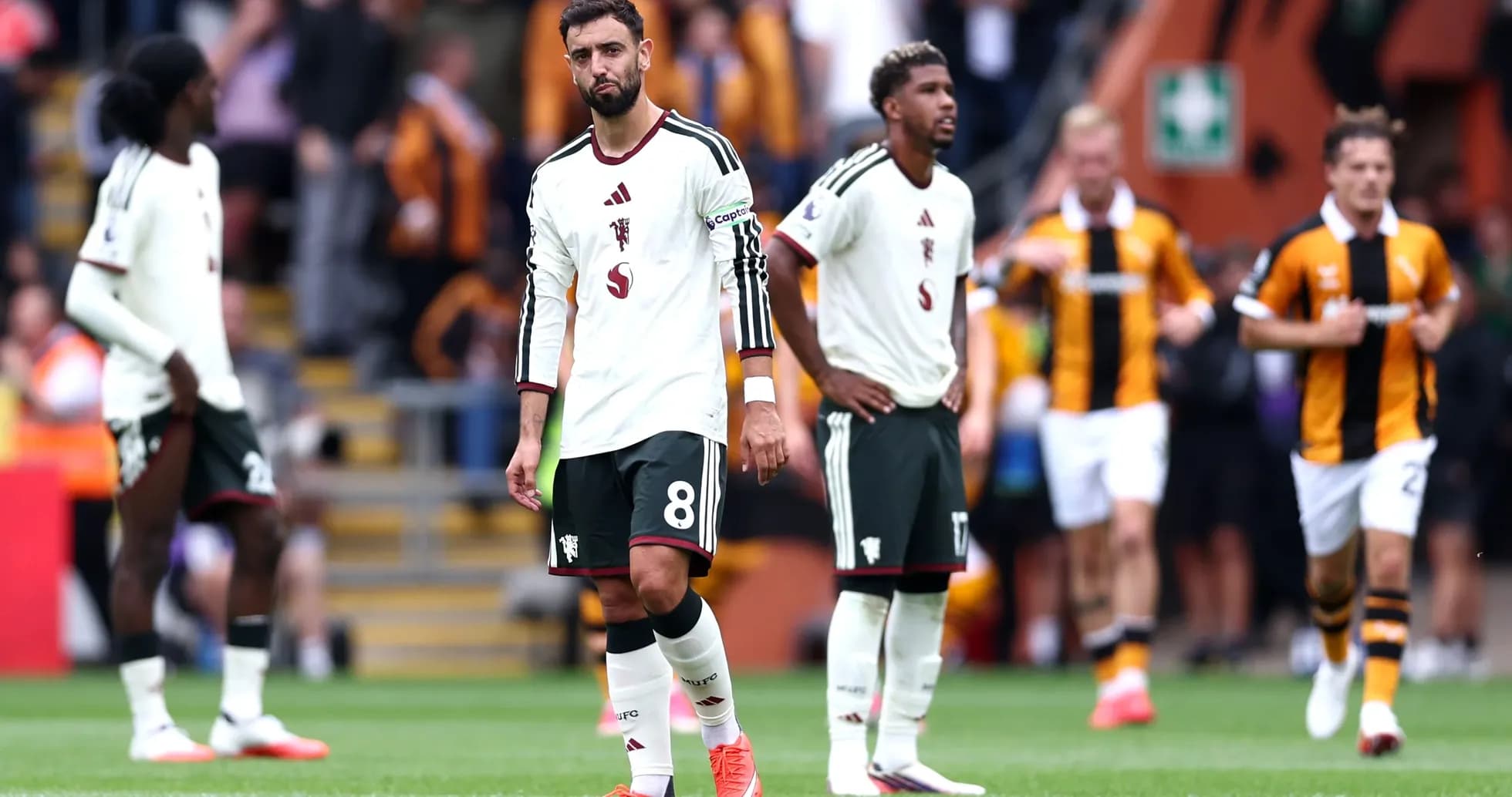 Swansea City players walking off after match defeat