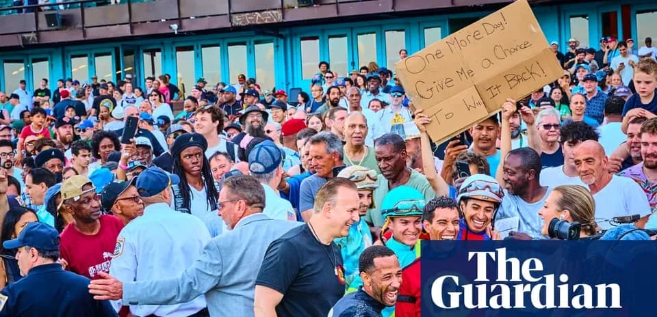 Crowd at event holding sign, smiling participants