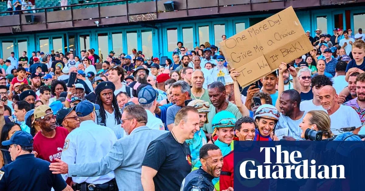 Crowd at event holding sign, smiling participants