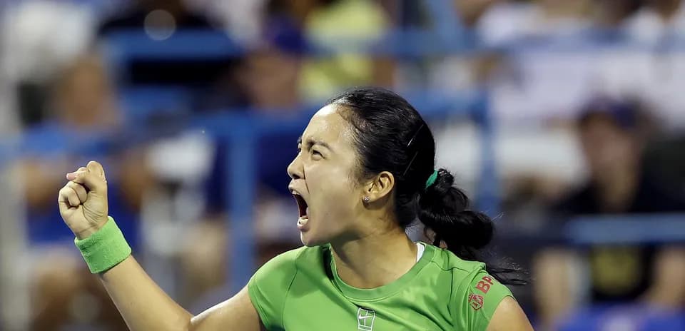 Tennis player celebrating a point during match