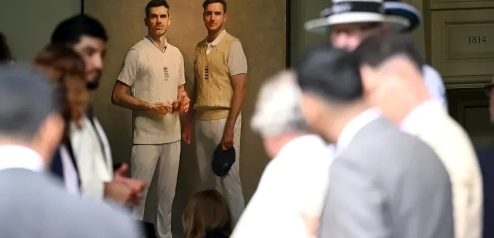 People gathered around a portrait of cricketers