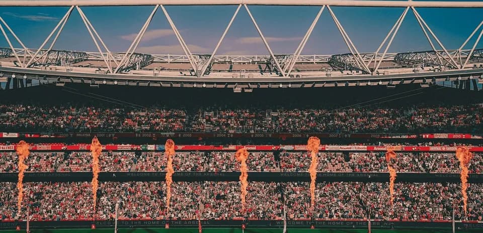 Stadium filled with fans and flame jets during event