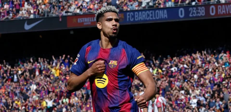 Barcelona player celebrating goal in front of crowd