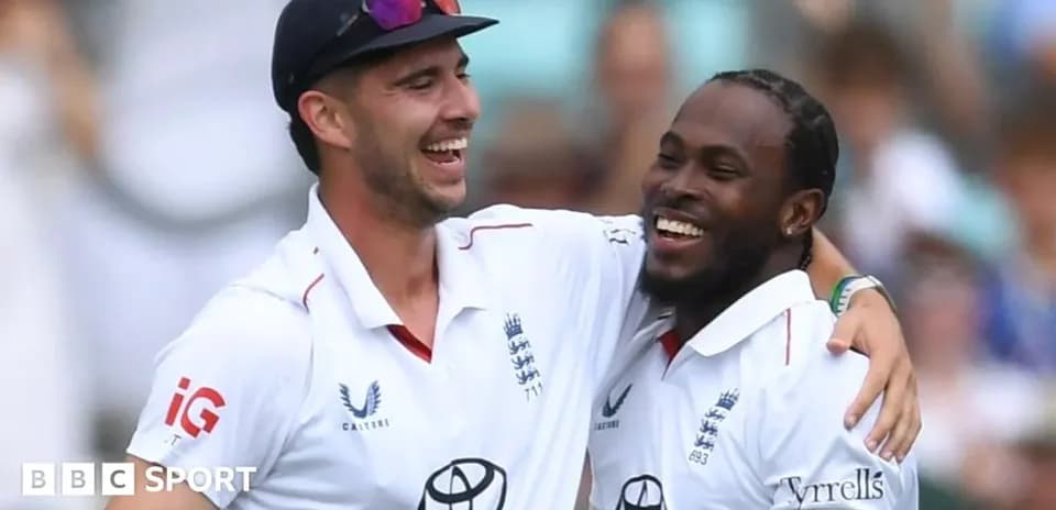 Two cricketers celebrating during a match