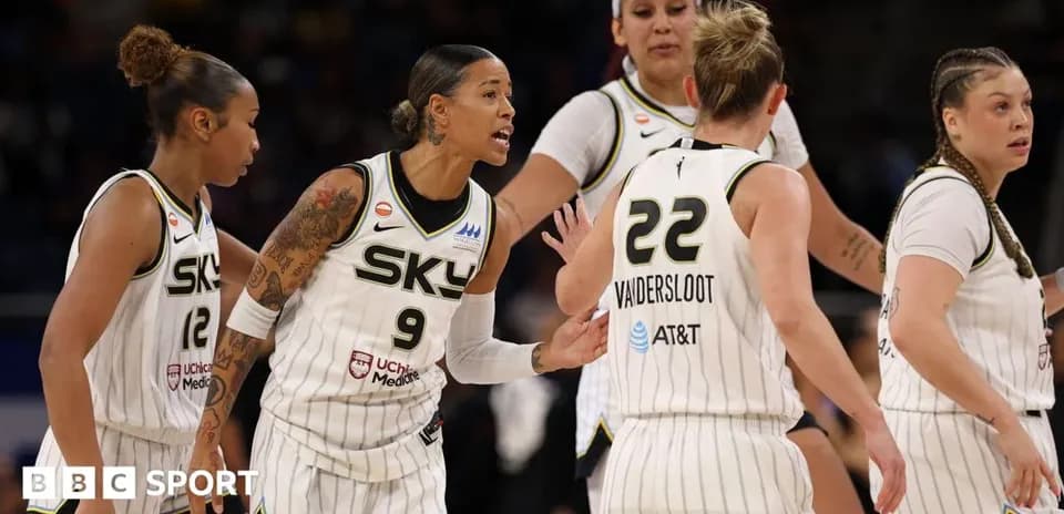 Chicago Sky players discussing strategy on the court