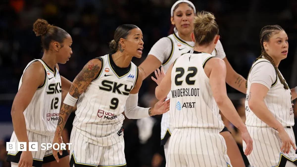 Chicago Sky players discussing strategy on the court