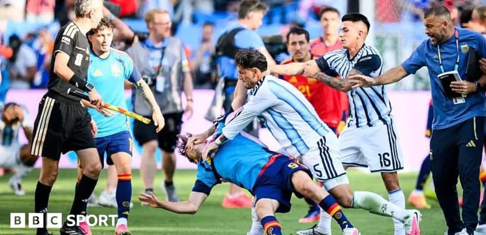 Players clashing during intense football match moment