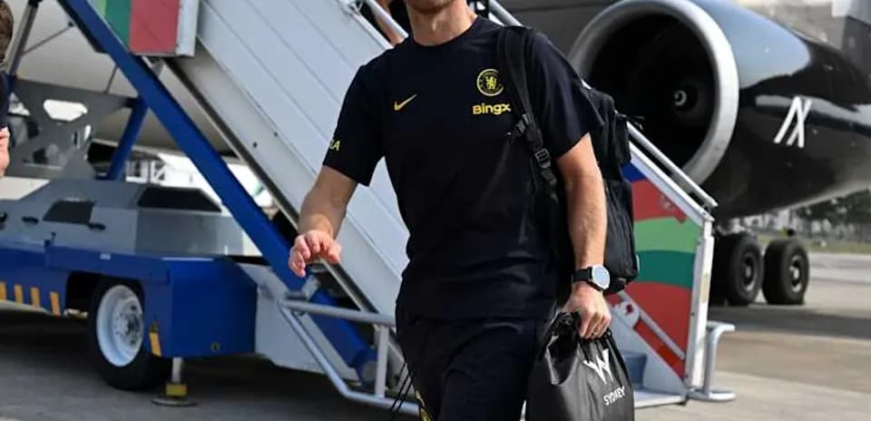 Football coach arriving at airport with bag