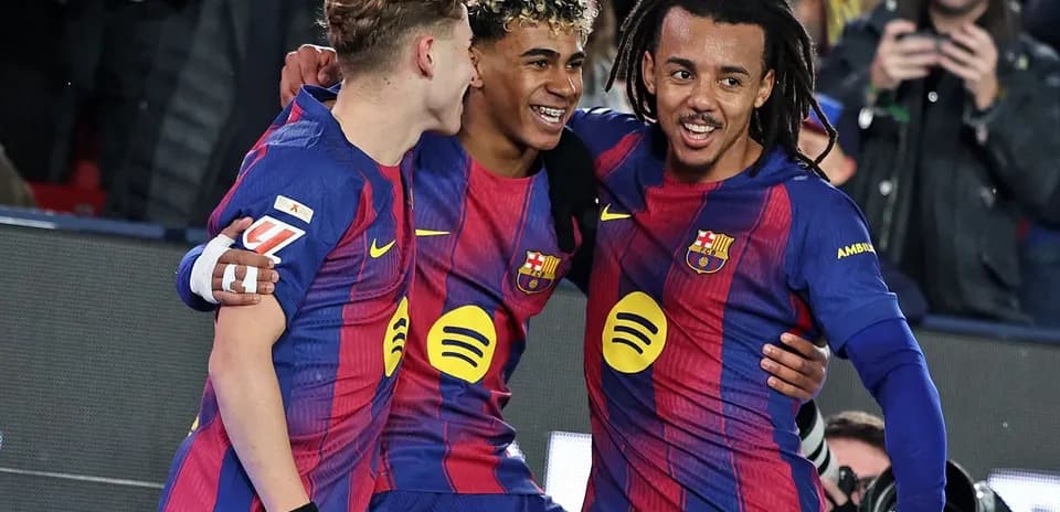 Barcelona players celebrating a goal on the field